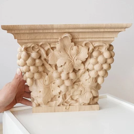 Pilaster caps with the bunch of grapes and leaves